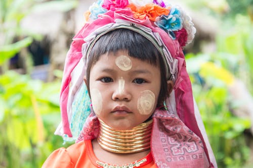 Little Girl in Traditional Outfit and Face Paint