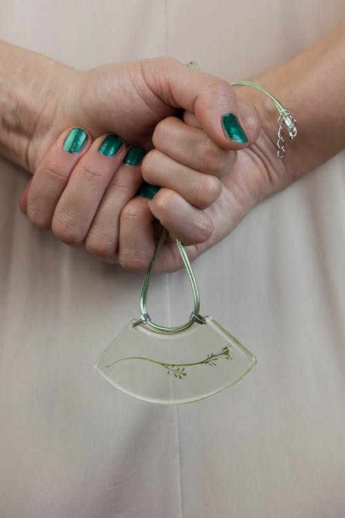 Free Two Person Holding Gold-colored Accessory on Focus Photo Stock Photo