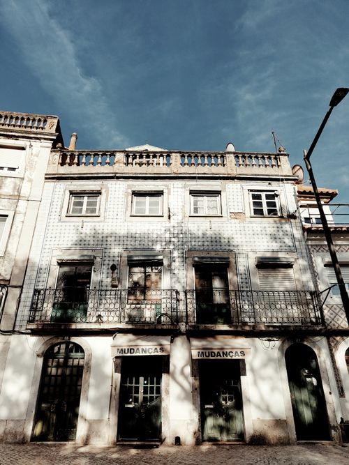 Free A historic building with traditional tiles under a clear blue sky, perfect for urban exploration. Stock Photo