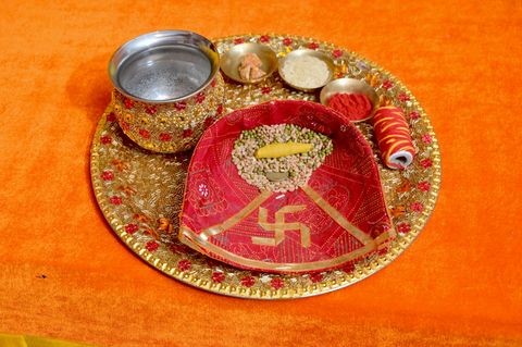 Decorated puja thali with katoris, roli and moli