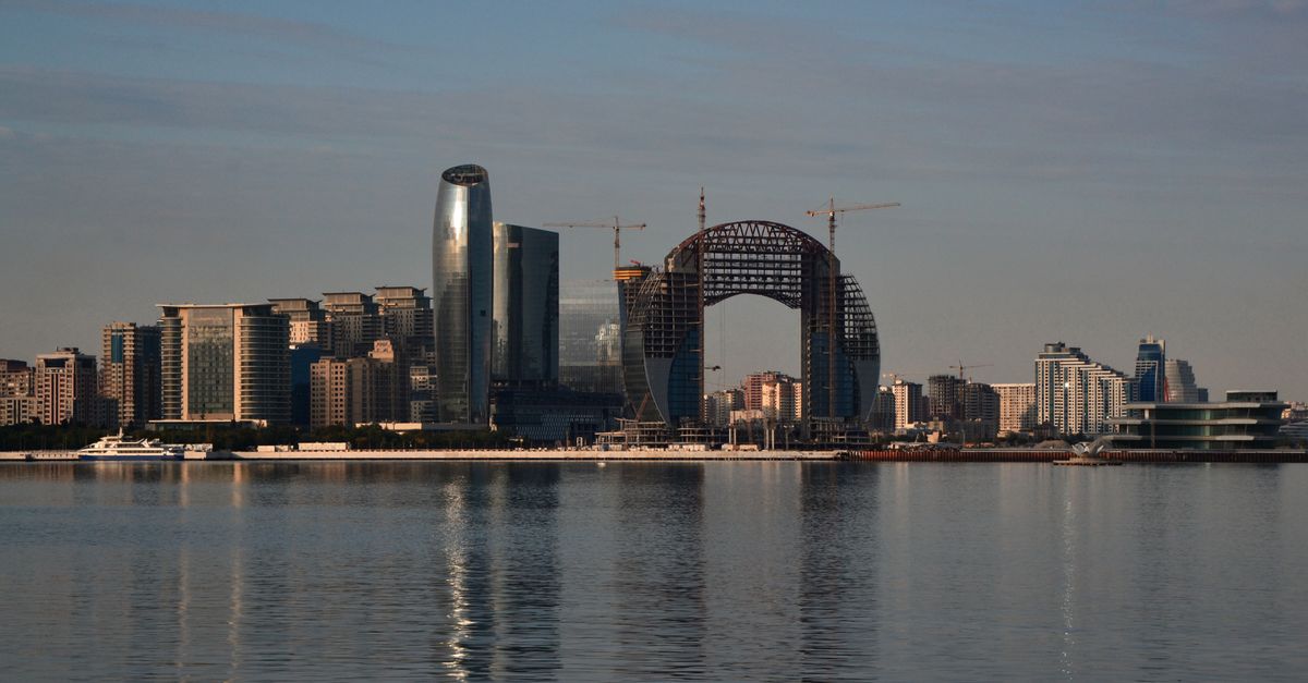 Stunning Baku skyline showcasing modern architecture along the waterfront under a clear sky.