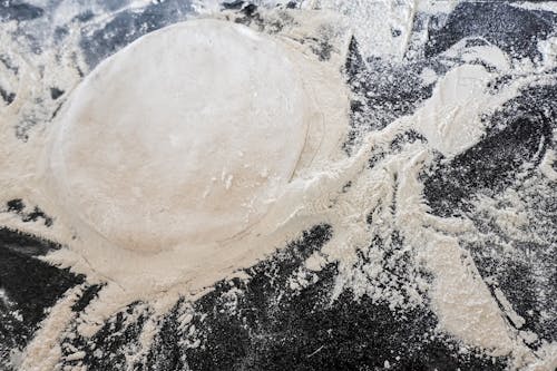 Pizza Dough Lying in Flour