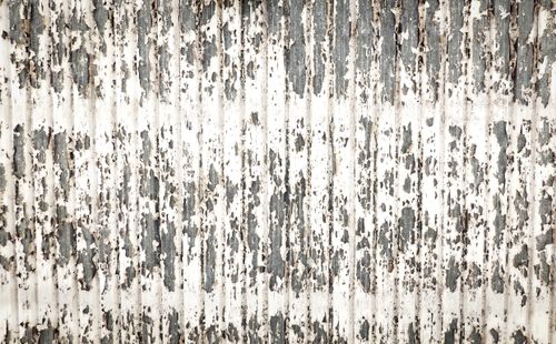 Free Close-up of a metal surface with peeling paint and decaying texture, perfect for backgrounds. Stock Photo