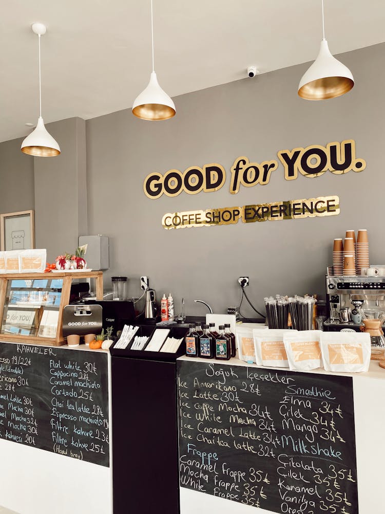 A Coffee Shop With Equipment At The Bar