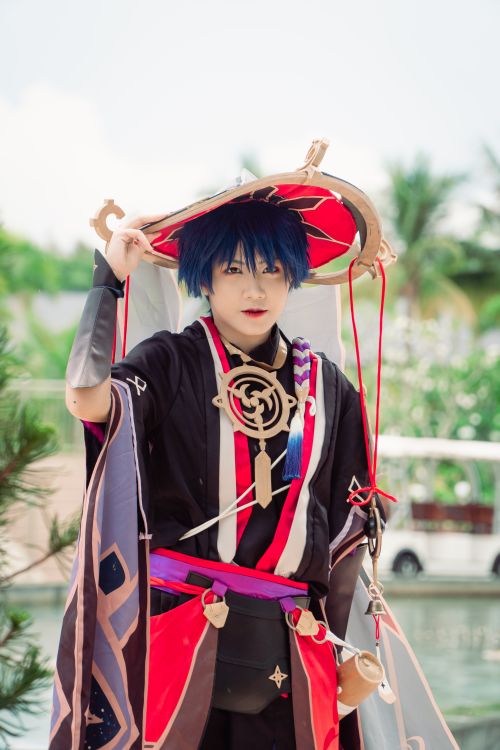 Free Colorful anime cosplay character posing outdoors in costume. Stock Photo