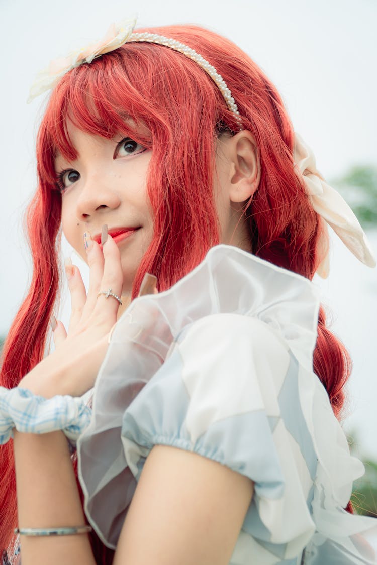 Woman With Dyed Hair And Bow In Hair