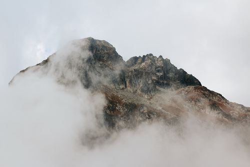 Free Dramatic mist-covered mountain peak in Cauterets, Occitanie, France. Stock Photo
