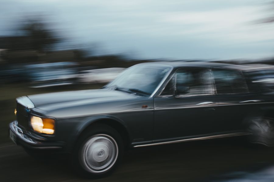 A classic car speeding with heavy motion blur — photo by josh marks on Pexels