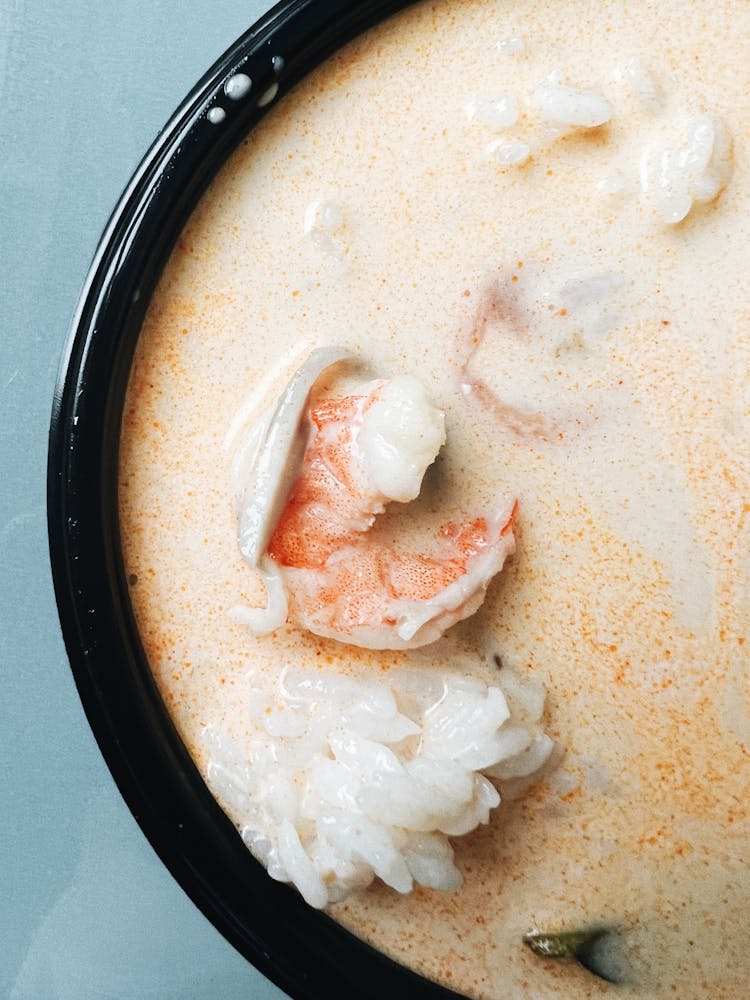 A Soup With Shrimp On A Ceramic Bowl