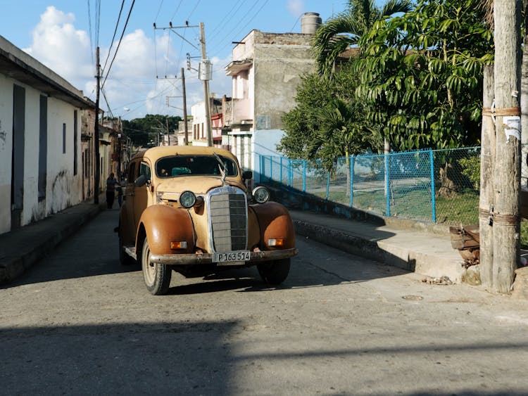 A Vintage Car On The Road 