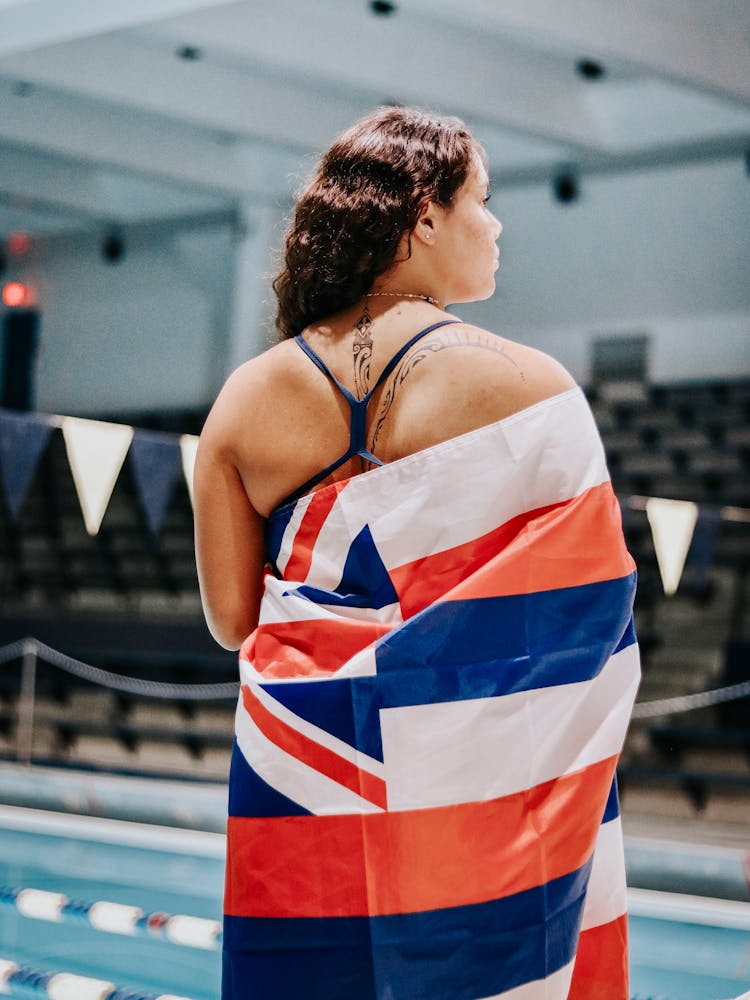 Bakc View Of A Swimmer Wrapped In The Hawaiian Flag 