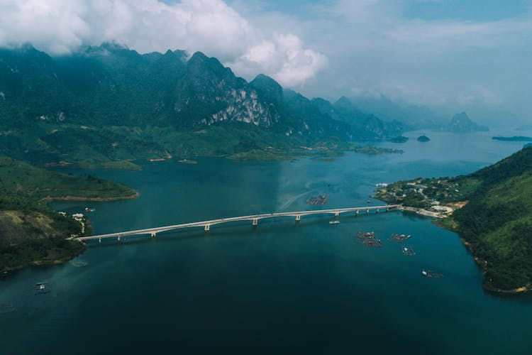 Drone Shot Of Pa Uon Bridge Surrounded With Green Mountains