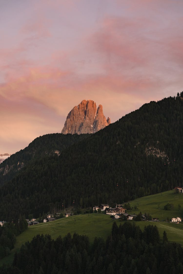 Mountain Landscape With Trees, Rocks And Red Sky