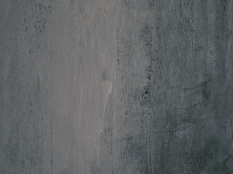 A dark, weathered concrete wall texture, perfect for backgrounds and design projects.