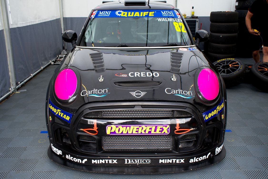 A Mini Cooper Race Car Inside a Garage · Free Stock Photo