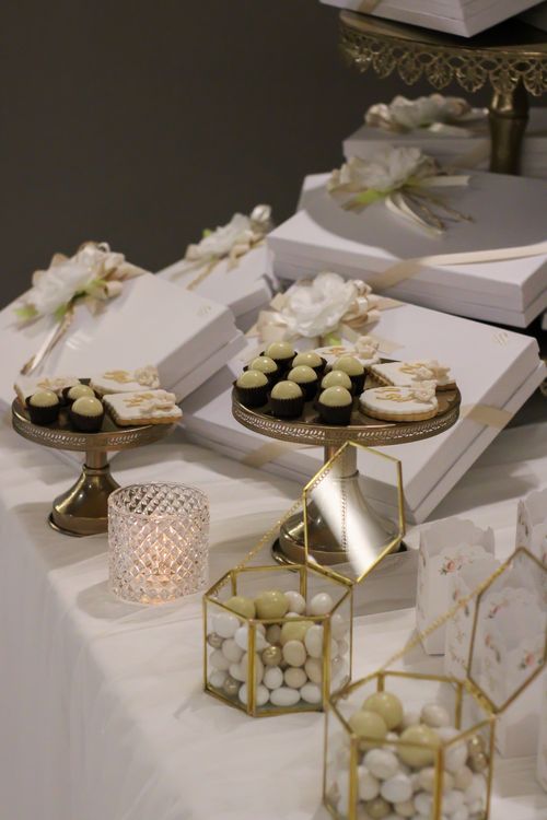 Free Beautifully arranged dessert table featuring chocolates and elegant decorations for special occasions. Stock Photo