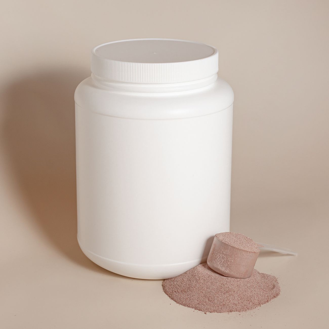 Unlabelled protein powder container and scoop used to illustrate product-specific testing