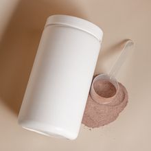 Protein powder tub with a filled scoop, photo by Supplements On Demand on Pexels