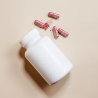 Capsules beside the kit bottle — photo by Supplements On Demand on Pexels