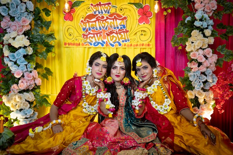 Women Sitting In Coloured Dress