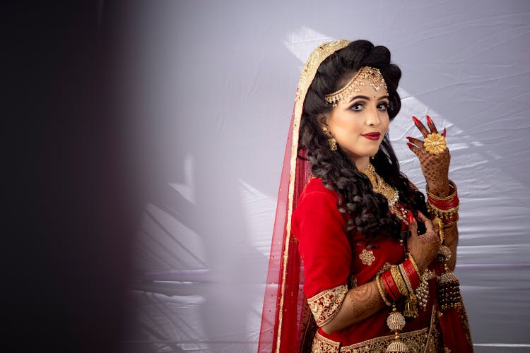 Woman In Traditional Costume On Grey Background