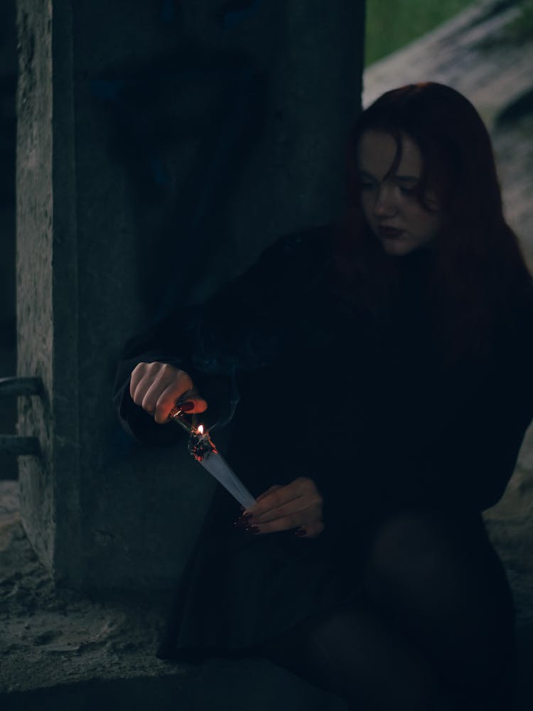 A Woman Burning Paper