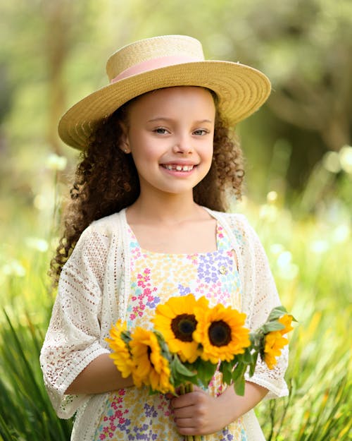 Cute Girl Holding Yellow Sunflowers