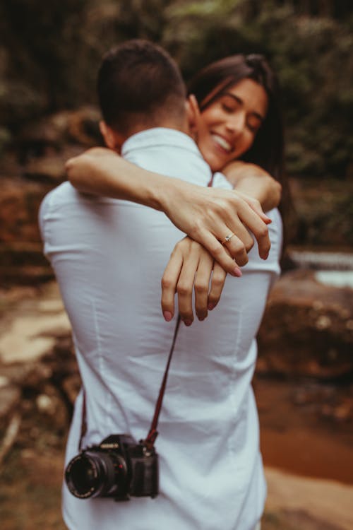 Smiling Woman Hugging a Man