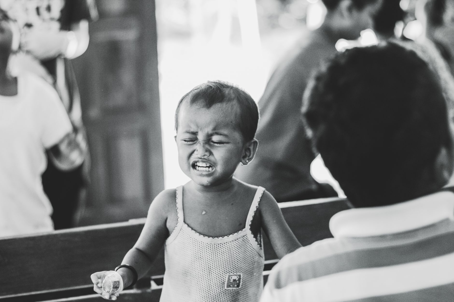 Child playing outdoors with focused expression
