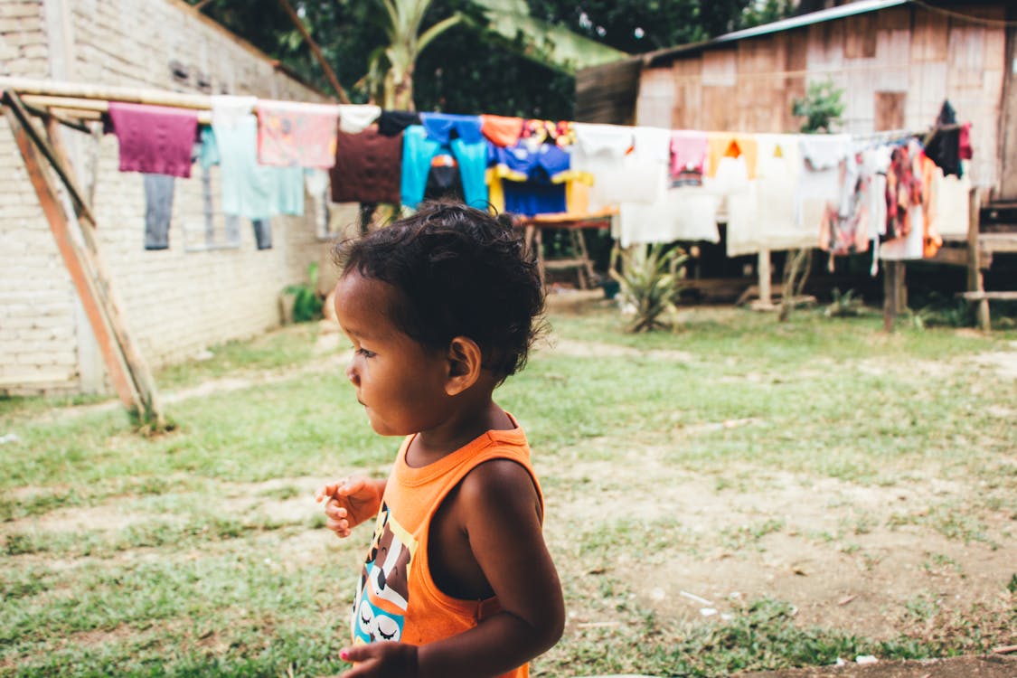 Boy Wearing Orange Tank Top