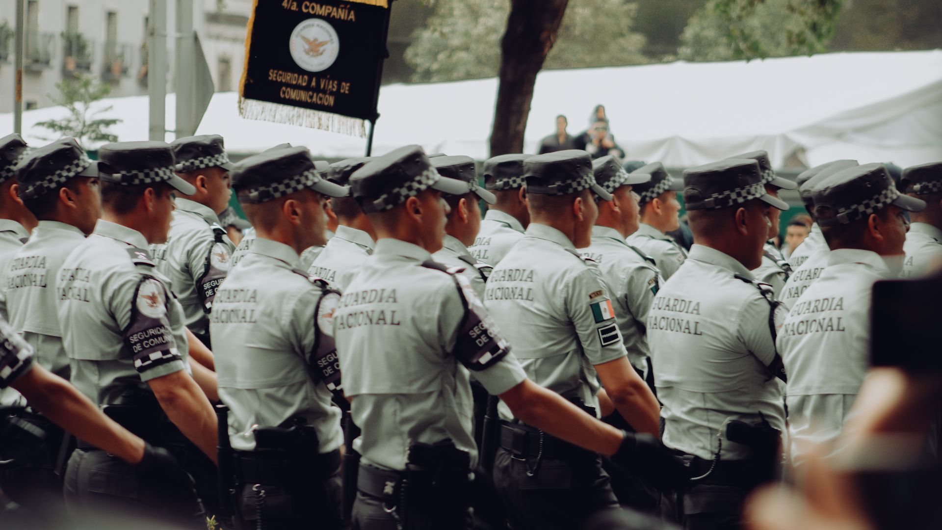 Modafinil for Security Guards: Boosting Alertness A group of uniformed National Guard soldiers marching in formation during a parade — modafinil for security guards