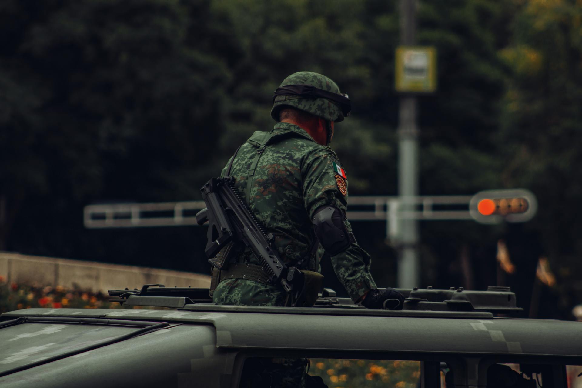 Soldier Standing on a Vehicle