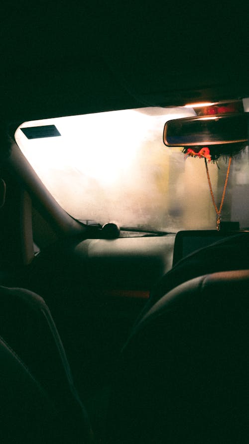 The Interior of a Motor Vehicle with a Foggy Windshield