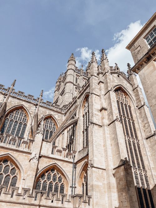 Free Majestic view of Bath Abbey with intricate architecture against a clear blue sky. Stock Photo