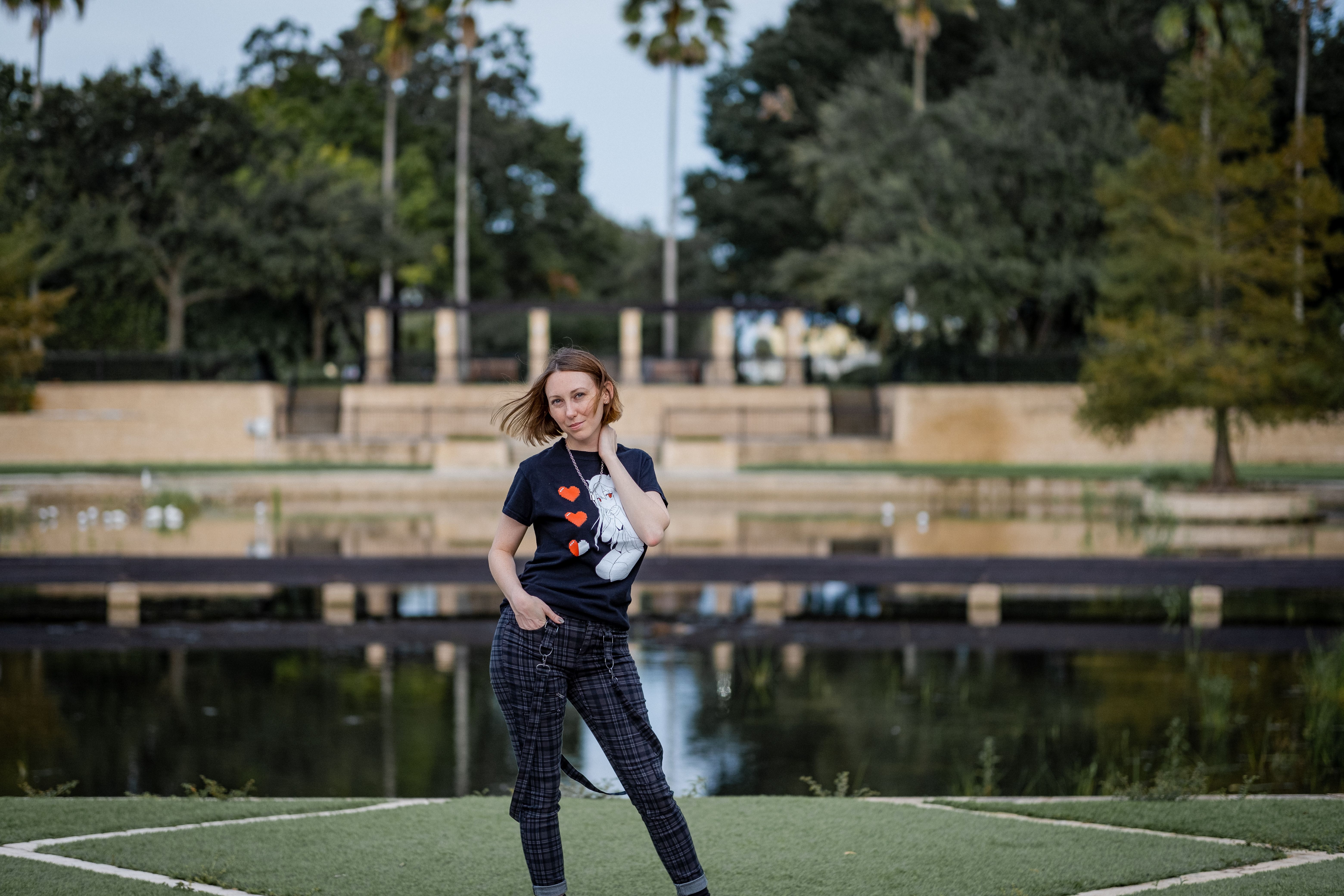 Smiling Woman Posing near Lake in Park · Free Stock Photo
