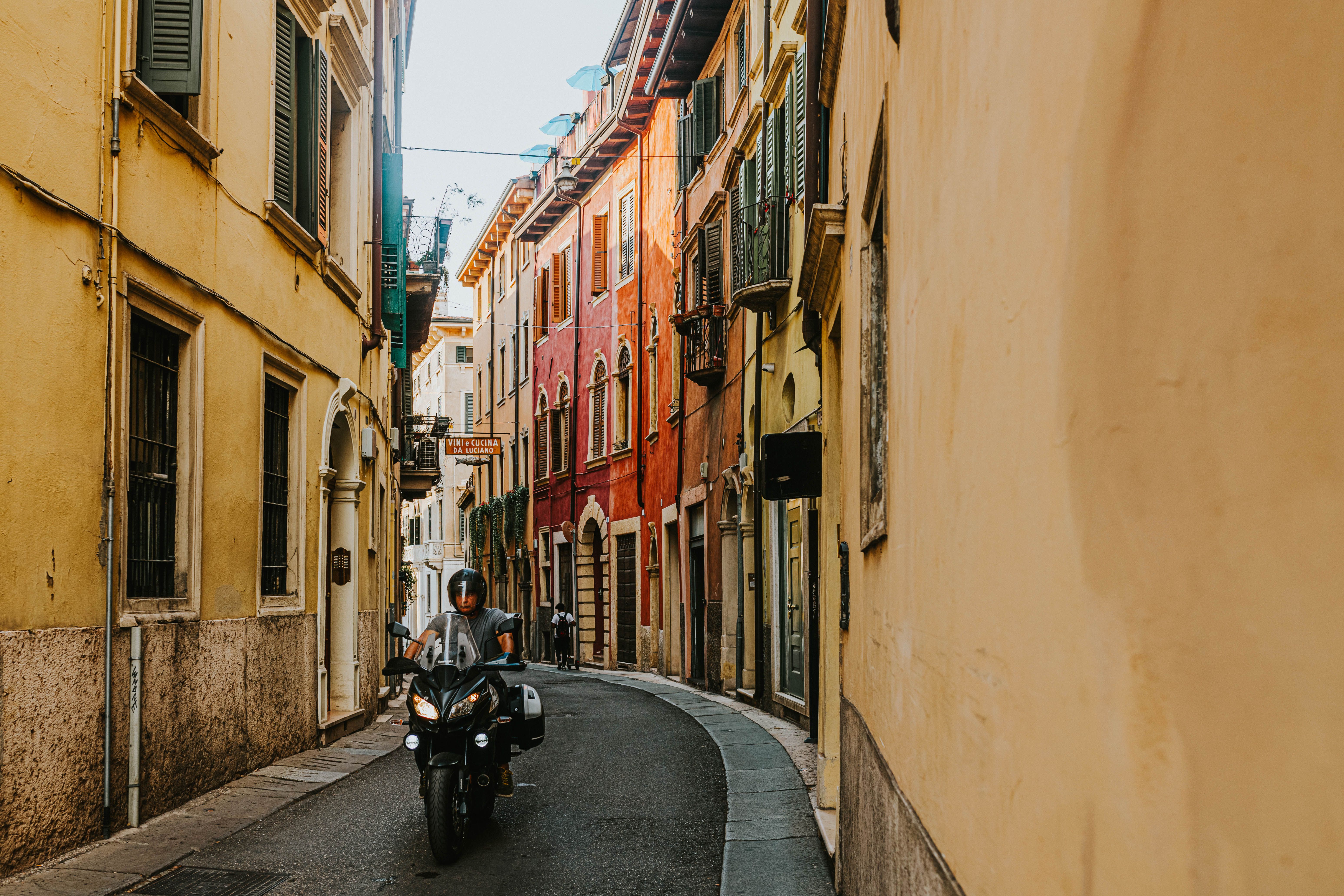 A Person Riding a Motorcycle on the Street · Free Stock Photo