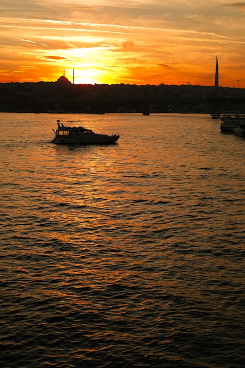 Silhouette of Ships on Water on Sunset