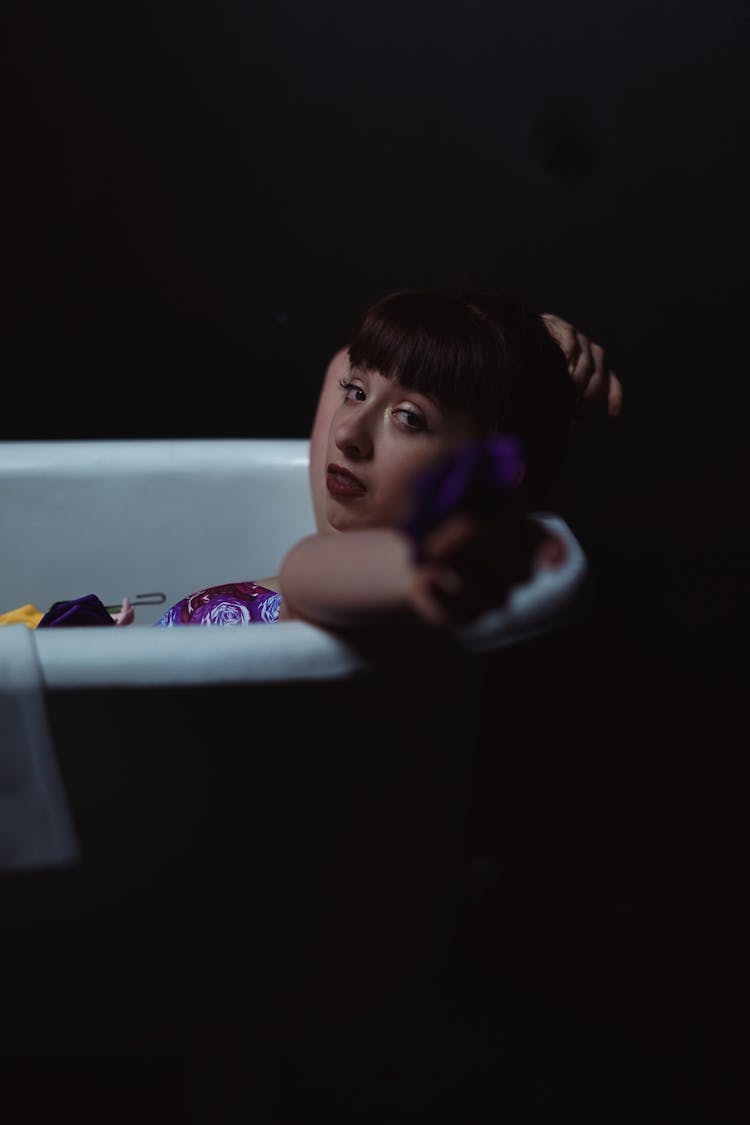 A Woman Lying In The Bathtub