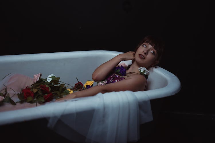 A Woman Lying In The Bathtub