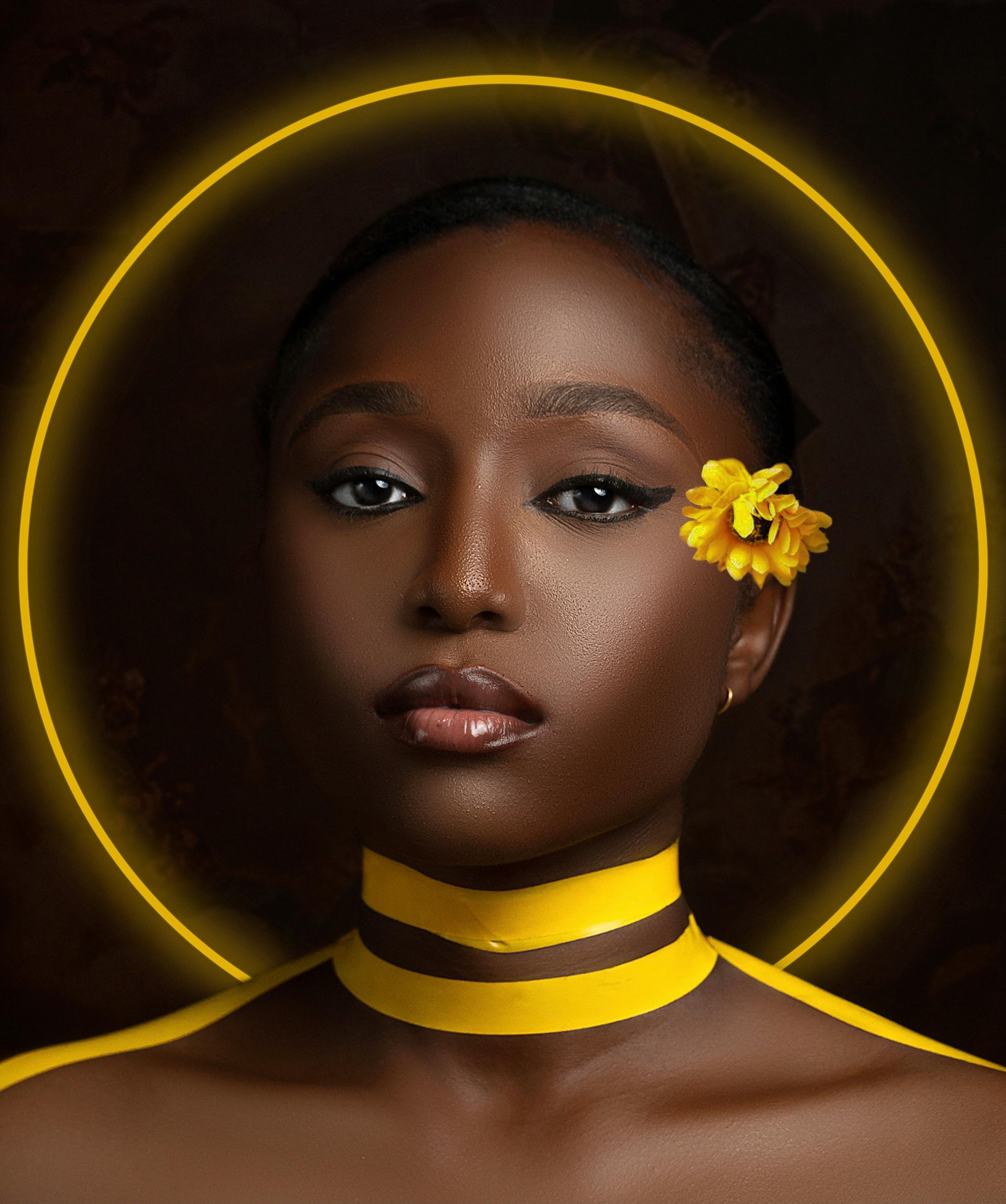 Art, beauty and black woman with gold makeup on brown background