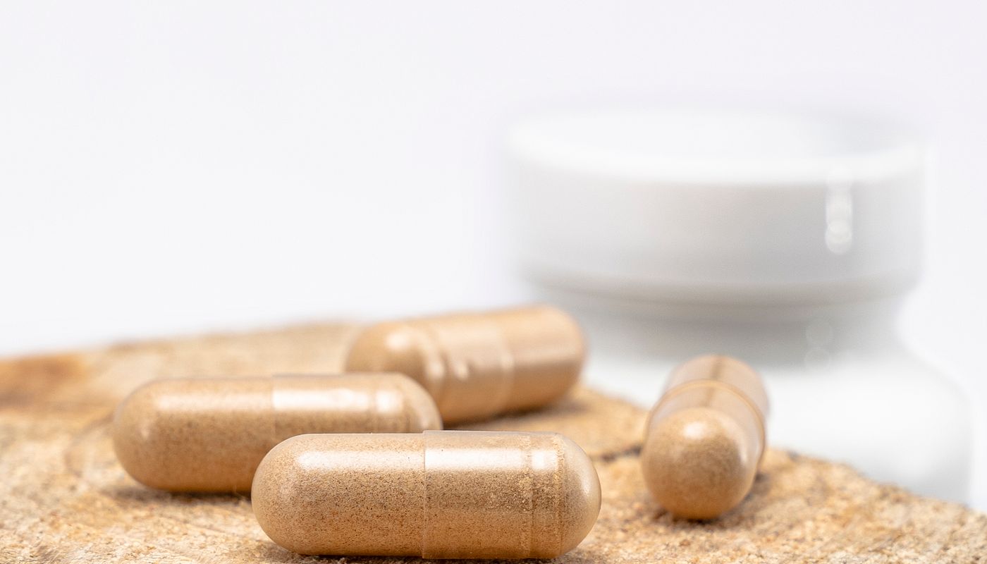 organic colon cleanse review — Capsules on Wooden Surface · Free. Photo: Pexels