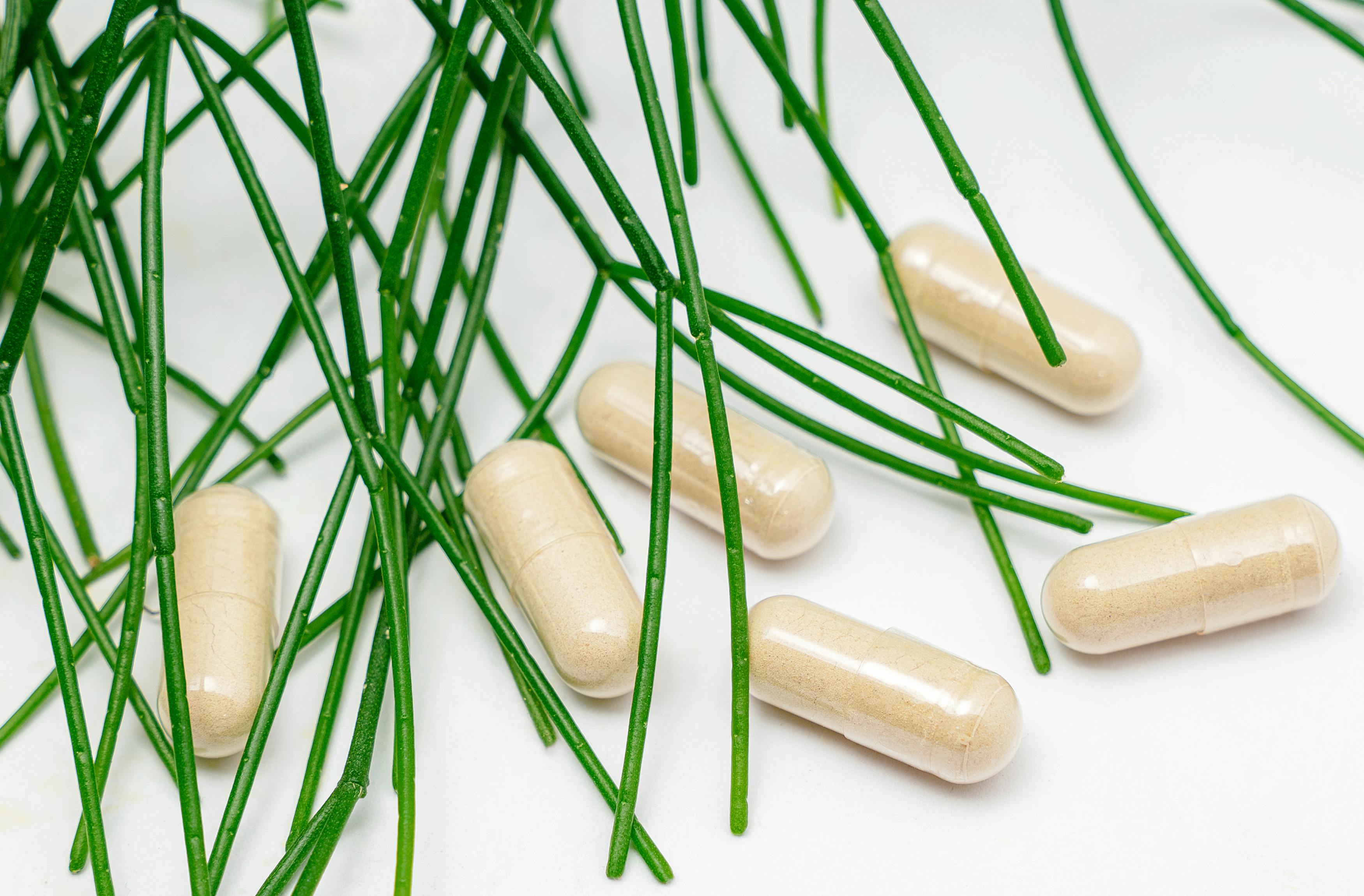 close up shot of capsules on white surface