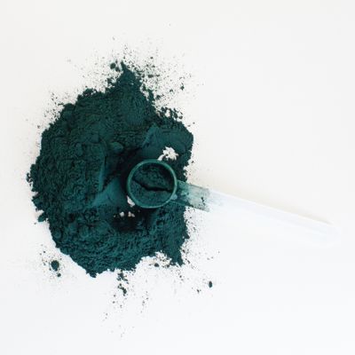 Green powder supplement packaging — photo by Supplements On Demand on Pexels