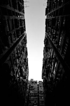 Striking low-angle black and white photo of high-rise buildings against the sky.