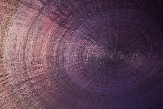 Intricate abstract spiral pattern with a gradient effect creating depth and texture.