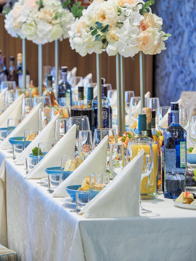 Table Setting With Wine Glasses And Napkins In Perspective