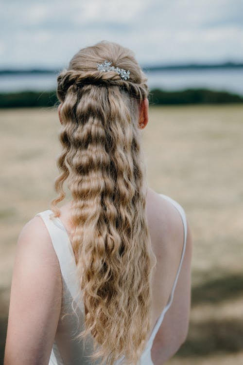 Back View of Woman with Wavy Blonde Hair