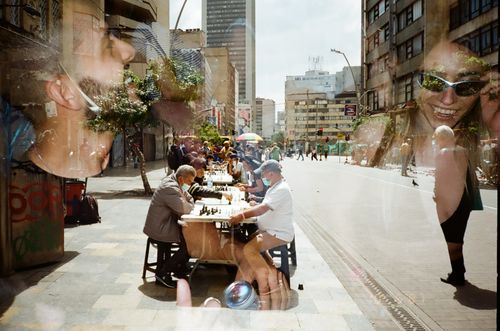 Free Artistic double exposure of people playing chess on Medellín streets, Colombia. Stock Photo