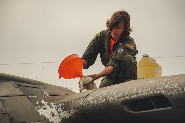 Person Cleaning Aircraft