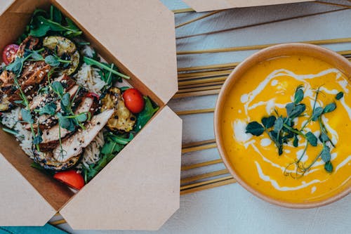 Free Top View of a Creamy Soup and a Salad with Chicken  Stock Photo